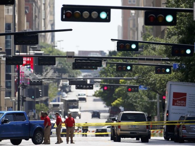 Police tape closes off the street as investigators look over the crime scene in Dallas, Texas, U.S. July 8, 2016 following a Thursday night shooting incident that killed five police officers. REUTERS/Carlo Allegri