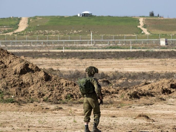 An Israeli soldier patrols near the Gaza Strip border with Israel, near the community of Nir Am, 03 February 2016. Israel is developing 'tunnel busting' technology near here and has protection from the Israeli army who patrol and keep watch over the Gaza Strip.