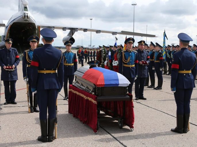 A handout picture released by the Russian Defense Ministry Press Service shows Russian honor guard standing at the coffin with the body of killed in Syria Russian serviceman Alexander Prokhorenko during a mourning ceremony at the Chkalovsky military airport outside Moscow, Russia, 05 May 2016. Alexander Prokhorenko will be buried at his home village in Orenburg region 06 May 2016. Alexander Prokhorenko, a special forces soldier, died when he called airstrikes on himslf