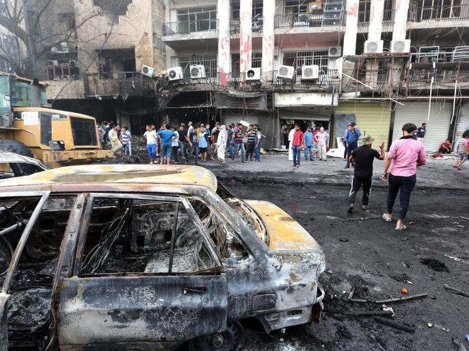 Iraqis gather at the site of suicide car bomb attack in the Karada district of central Baghdad, Iraq, 03 July 2016. At least 23 people were killed and 70 others were wounded in a suicide car bomb attack targeted Karada district of Baghdad and other attack by a roadside bomb in Shaab market , Iraqi police said.