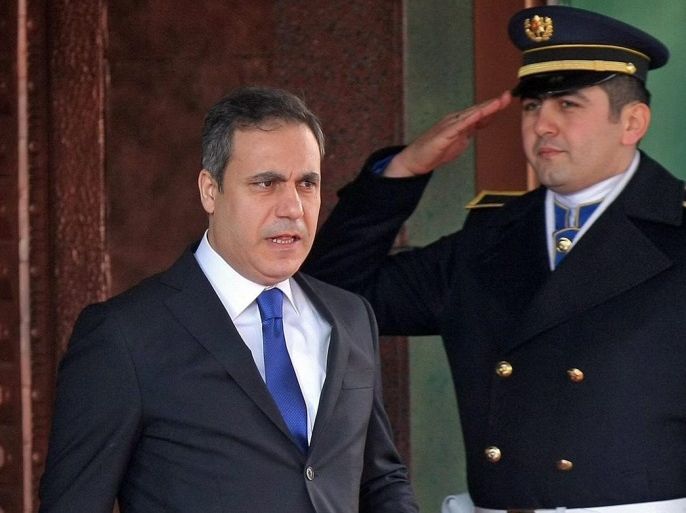 A picture made available on 07 February 2015 of the head of Turkey's intelligence service, Hakan Fidan (L) leaving the Turkish Prime Minister building, in Ankara, Turkey, 13 August 2012. Hakan Fidan, Turkey's intelligence chief and a close confidant of President Recep Tayyip Erdogan, has resigned from his post in order to be eligible to run in parliamentary elections later this year, the state-run Anadolu news agency reported 07 February 2015. His name has been mentio