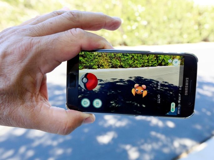 The augmented reality mobile game "Pokemon Go" by Nintendo is shown on a smartphone screen in this photo illustration taken in Palm Springs, California U.S. July 11, 2016. REUTERS/Sam Mircovich/Illustration