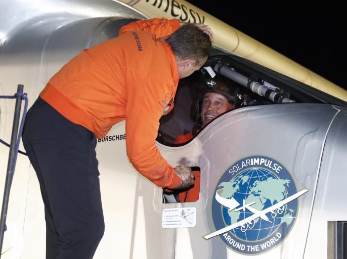 Andre Borschberg (L), Swiss Pilot and co-founder of the Solar Impulse project, welcomes Swiss Pilot Bertrand Piccard (R), initiator and chairman of the Solar Impulse project, after the Solar Impulse 2 aircraft landed in Abu Dhabi, United Arab Emirates, 26 July 2016. The 1,956 km flight from Cairo, Egypt, to Abu Dhabi was the last leg of the round-the-world flight of the Swiss long-range experimental solar-powered aircraft. The 17 legs and 35,000 km long journey around t