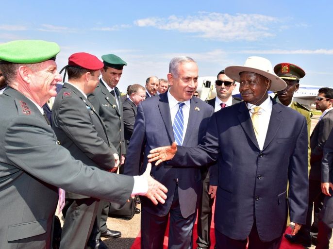 Israeli Prime Minister Benjamin Netanyahu (C) introduces members of his delegation to Uganda's President Yoweri Museveni after arriving to commemorate the 40th anniversary of Operation Entebbe at the Entebbe airport in Uganda, July 4, 2016. Presidential Press Unit/Handout via REUTERS ATTENTION EDITORS - THIS IMAGE WAS PROVIDED BY A THIRD PARTY. FOR EDITORIAL USE ONLY. NO RESALES. NO ARCHIVES.