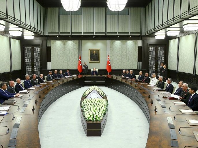 Turkey's President Tayyip Erdogan (C) heads the National Security Council meeting in Ankara, Turkey, June 29, 2015. REUTERS/Kayhan Ozer/Presidential Palace Press Office/Handout via Reuters ATTENTION EDITORS - THIS PICTURE WAS PROVIDED BY A THIRD PARTY. REUTERS IS UNABLE TO INDEPENDENTLY VERIFY THE AUTHENTICITY, CONTENT, LOCATION OR DATE OF THIS IMAGE. THIS PICTURE IS DISTRIBUTED EXACTLY AS RECEIVED BY REUTERS, AS A SERVICE TO CLIENTS. FOR EDITORIAL USE ONLY. NOT FOR S