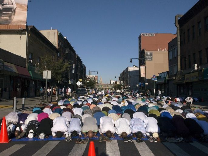 Worshippers take part in Eid Al-Adha prayers outside the Masjid At-Taqwa mosque in the Brooklyn borough of New York September 24, 2015. Muslims across the world celebrate the annual festival of Eid al-Adha or the Feast of the Sacrifice. REUTERS/Stephanie Keith