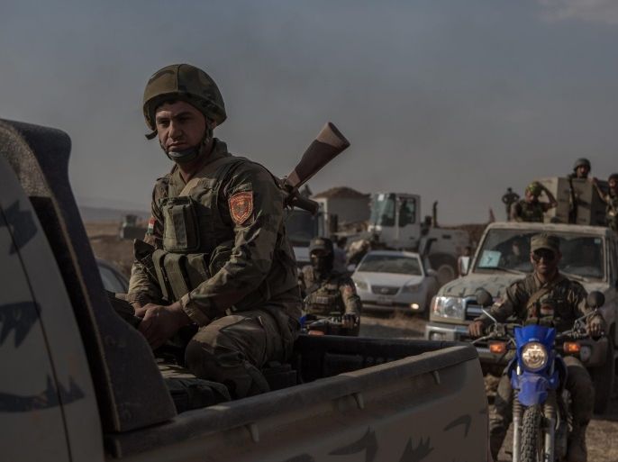 A photograph made available on 30 May 2016 shows Kurdish Peshmerga forces moving in Mufti village after it was recaotrued from Islamic State (IS), Kurdistan region, north Iraq, 29 May 2016. Reports state the Kurdish Regional Government launched an offensive to take back villages that fell to the Islamic State (IS) in 2014, as part of the ongoing efforts to clear a path to retake Mosul, Iraq's second largest city.