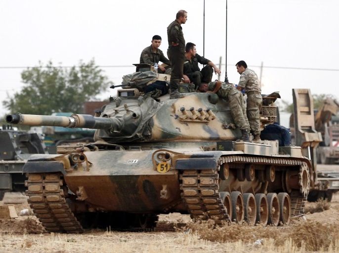 Turkish soldiers stand on tanks at the Syrian border as part of their offensive against the so-called Islamic State (ISIS or IS) militant group in Syria, in Karkamis district of Gaziantep, Turkey, 24 August 2016. The Turkish army launched an offensive operation against ISIS in Syria's Jarablus with its war jets and army troops in coordination with the US led coalition war planes.