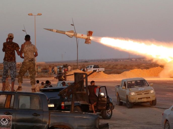 Fighters of Libyan forces allied with the U.N.-backed government fire a rocket at Islamic State fighters in Sirte, Libya, August 4, 2016. REUTERS/Goran Tomasevic