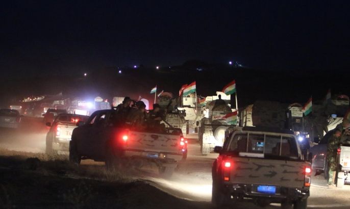 Military vehicles of the Kurdish Peshmerga forces are seen on the southeast of Mosul, Iraq, August 14, 2016. REUTERS/Azad Lashkari