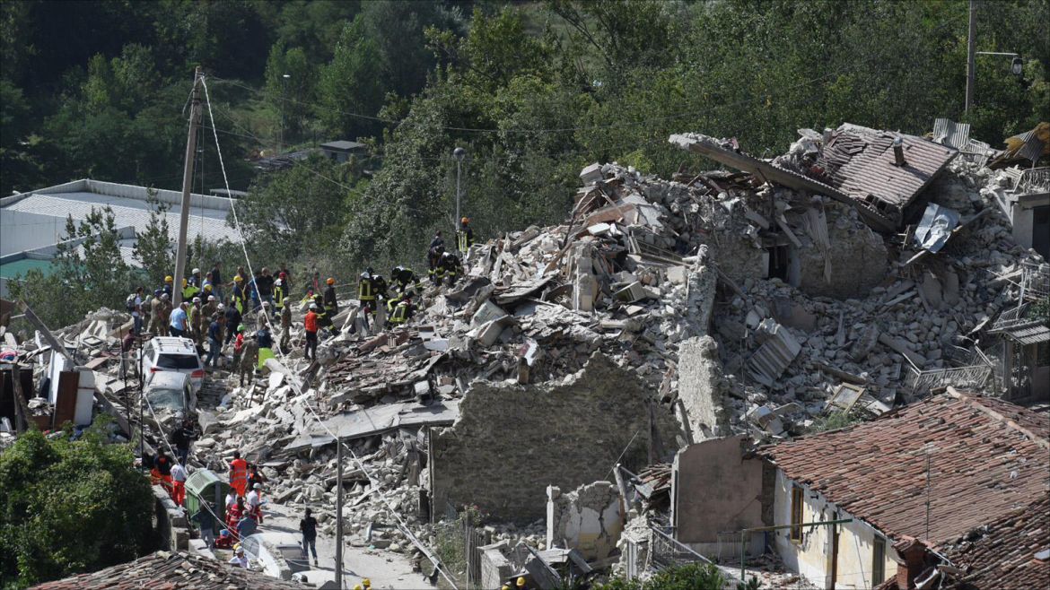 epa05508306 An emergency services vehicle is parked in front of collapsed buildings in Pescara del Tronto, near Arquata del Tronto municipality, Ascoli Piceno province, Marche Region, central Italy, 24 August 2016, following a 6.2 magnitude earthquake, according to the United States Geological Survey (USGS), that struck at around 3:30 am local time (1:30 am GMT). The quake was felt across a broad section of central Italy, including the capital Rome where people in homes in the historic center felt a long swaying followed by aftershocks. According to reports at least 21 people died in the quake, 11 in Lazio and 10 in Marche regions.  EPA/CROCCHIONI
