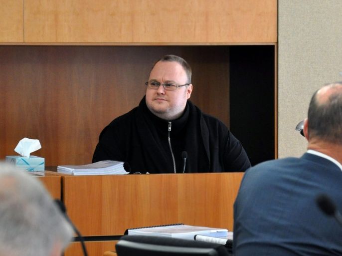(FILE) A file photograph shows German-Finnish Internet entrepreneur Kim Dotcom (C, back) looking on during a hearing at the Auckland District Court, in Auckland, New Zealand, 08 October 2015. Internet entrepreneur Kim Dotcom's appeal of his extradition to the United States has begun at Auckland's High Court, New Zealand, on 29 August 2016. Dotcom and three other defendants - Mathias Ortmann, Bram van der Kolk and Finn Batato - have been involved in a lengthy legal bat
