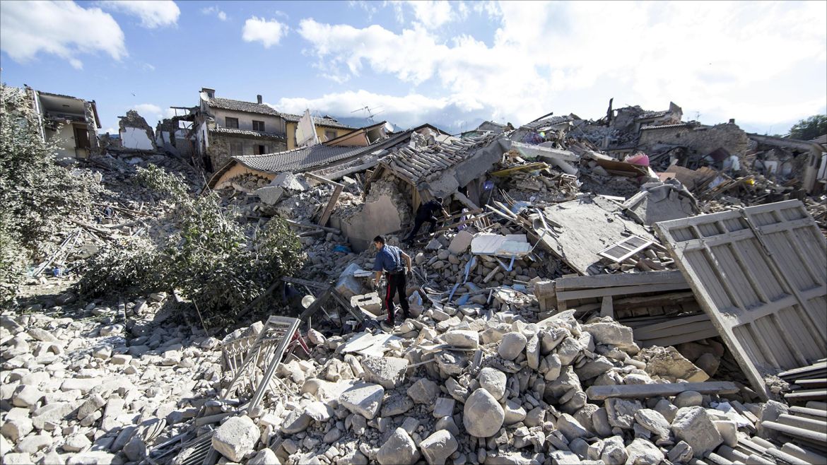 epa05508393 A member of the Carabinieri, the Italian national police force, looks for missing people amid the rubble of a collapsed building in Amatrice, central Italy, following a 6.2 magnitude earthquake, according to the United States Geological Survey (USGS), that struck at around 3:30 am local time (1:30 am GMT). The quake was felt across a broad section of central Italy, in Umbria, Lazio and Marche Regions, including the capital Rome where people in homes in the historic center felt a long swaying followed by aftershocks. According to reports at least 37 people died in the quake.  EPA/MASSIMO PERCOSSI