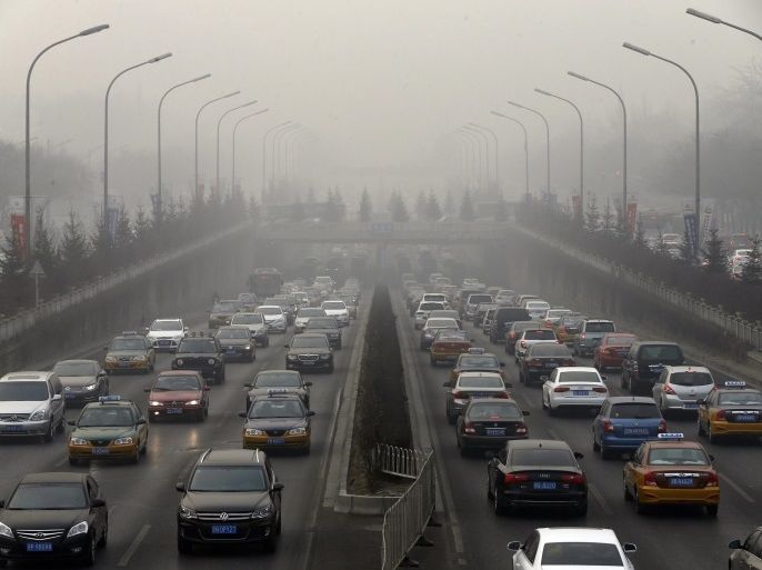 (FILE) A file picture dated 16 January 2014 shows a general view of a main road amidst haze in Beijing, China. UN climate negotiators meeting in Lima, Peru, agreed 14 December 2014 upon a few basic principles they hope will guide them when they resume their work in Paris next year. The final document agreed at the conference does not lay out specific plans. Instead, it lists a variety of options that diplomats might follow as they try to reach consensus on a way of low
