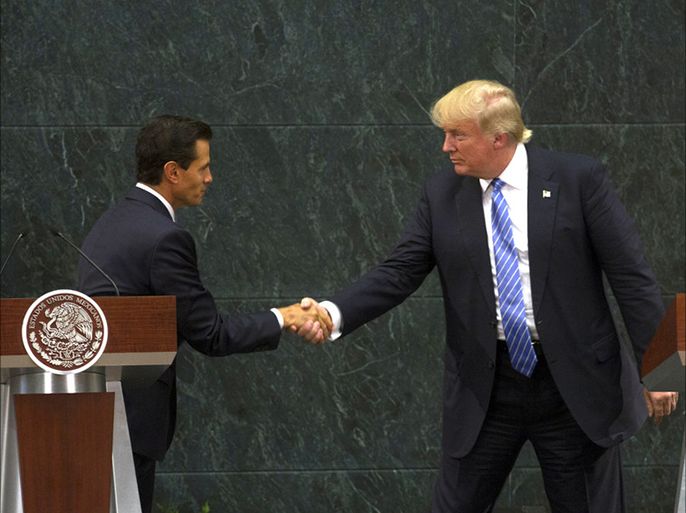 epaselect epa05517650 US Republican presidential candidate Donald Trump (R) shakes hands with President of Mexico Enrique Pena Nieto in Los Pinos, Mexico City, Mexico, 31 August 2016