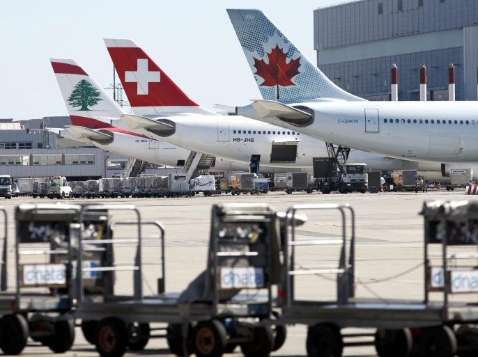 An Airbus A330-343 of the Swiss International Air (C) is flanked by an Air Canada plane (R) and a Middle East Airline (MEA) plane from Lebanon (L) at the Geneva Airport, in Geneva, Switzerland, 24 August 2016. Media reports claim that the owners of the Swiss airline, German Lufthansa Group, evaluates the possibility to pull out the Swiss carrier from the Geneva airport, where they could be replaced by the Lufthansa's budget airline Eurowings.