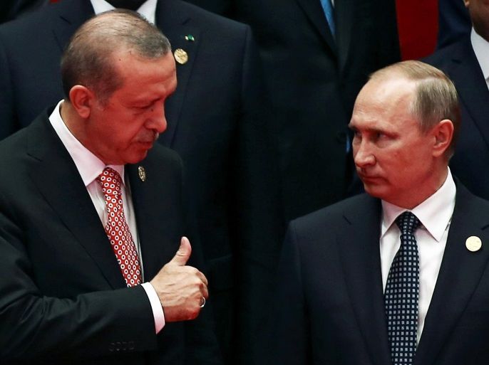 REFILE - ADDING FIRST NAME OF TURKEY'S PRESIDENT Russia's President Vladimir Putin interacts with Turkey's President Tayyip Erdogan as they pose for a group picture during the G20 Summit in Hangzhou, Zhejiang province, China September 4, 2016. REUTERS/Damir Sagolj TPX IMAGES OF THE DAY