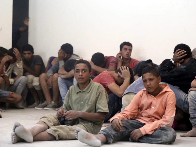 Survivors from a boat that capsized sit in a police station in the port city of Rosetta, 250km north of Cairo, Egypt, 21 September 2016. According to Egypt's health ministry, 42 people died after a boat carrying migrants capsized. The number of passengers on board is not yet confirmed, with media reporting between 300 and 600.  EPA/MOHAMED ELHOSRY  EGYPT OUT