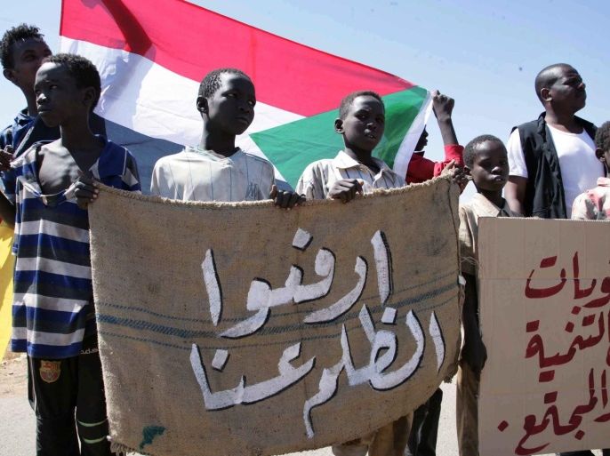 Young Sudanese children hold a banner reading in Arabic 'Lift the injustice' during a protest against longstanding US sanctions on Sudan, outside the US embassy, Khartoum, Sudan, 03 November 2015. The US imposed economic and trade sanctions on the country 1997, in response to allegations of harbouring terror groups and human rights abuses against the regime of Omar al-Bashir.