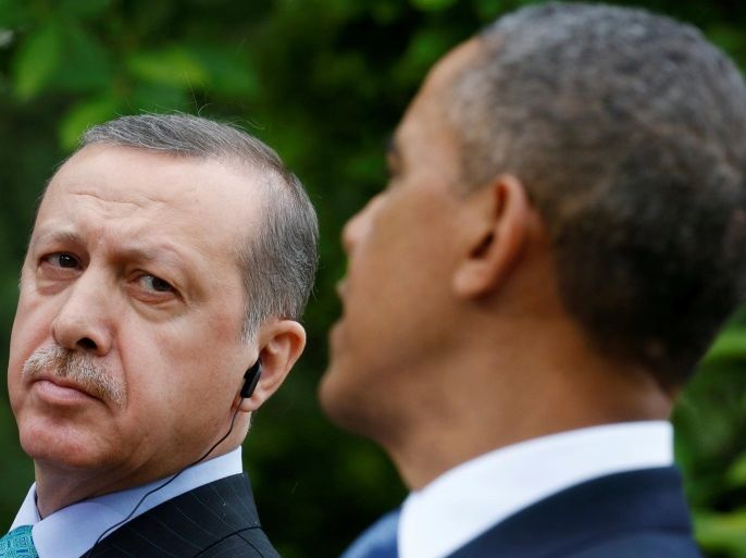 FILE PHOTO - Turkish Prime Minister Recep Tayyip Erdogan (L) listens as U.S. President Barack Obama (R) addresses a joint news conference in the White House Rose Garden in Washington, May 16, 2013. REUTERS/Kevin Lamarque/File Photo