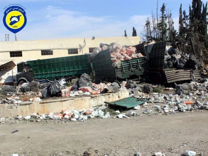 A handout picture made available by Syria Civil Defense volunteer group (The White Helmets) shows the remains of the humanitarian convoy organized by the Red Crescent and the Red Cross that was bombed in an air-strike a day before, Urum al-Kubra town, Aleppo, Syria, 20 September 2016. 12 were dead, including the head of the Red Crescent center in Aleppo, and 18 injuried, as well as 18 of the 31 trucks destroyed. Both the Russian military spokesman and Syrian Military an