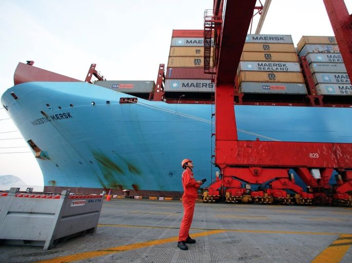A worker is seen next to the Maersk's Triple-E giant container ship Maersk Majestic, one of the world's largest container ships, at the Yangshan Deep Water Port, part of the Shanghai Free Trade Zone, in Shanghai, China September 24, 2016. Picture taken September 24, 2016. REUTERS/Aly Song