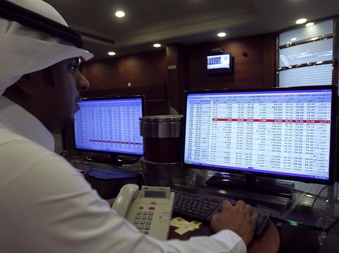 A broker monitors stock prices on a screen at the Saudi Investment Bank in Riyadh in this file photo taken September 5, 2013. Saudi Arabia plans to open its stock market, the Arab world's biggest, to direct investment by foreign financial institutions in the first half of next year, the market regulator said on Tuesday. REUTERS/Faisal Al Nasser/Files (SAUDI ARABIA - Tags: BUSINESS)