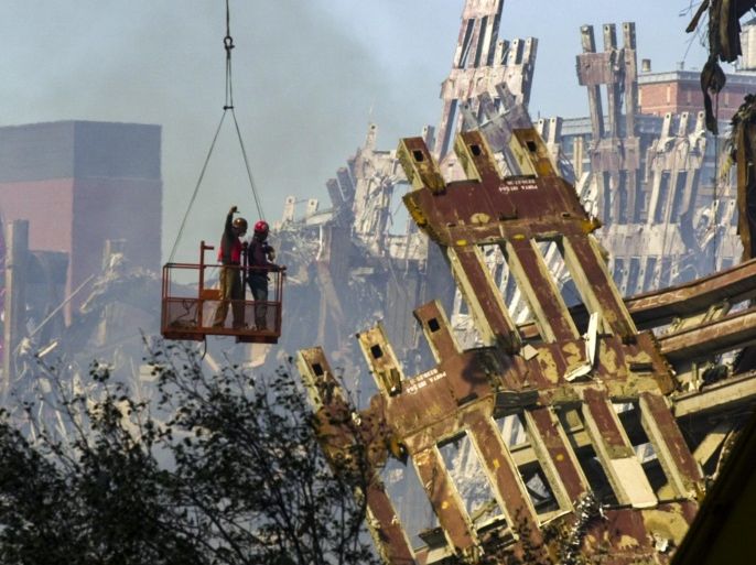 An image issued 10 September 2016 showing workmen beginning the task of dismantling the destroyed remains of the 7 World Trade Center building in New York, New York, USA on 17 September 2001. Terrorists flew two airliners into the twin towers of the World Trade Center causing them to collapse and killing more than 3000 people on 11 September 2001. The 15th anniversary of the worst terrorist attack on US soil will be observed on 11 September 2016