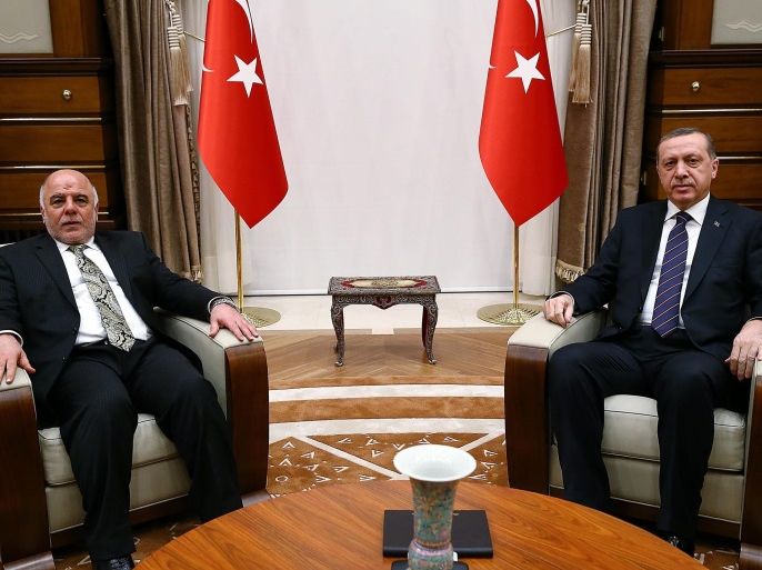 A handout picture provided by the Press Office of the Turkish President shows the Iraqi Prime Minister, Haider al-Abadi (L), and the Turkish President, Recep Tayyip Erdogan (R), during their meeting in Ankara, Turkey, 25 December 2014. According to local reports al-Abadi was in Ankara to discuss bilateral economic and security relations between Iraq and Turkey, especially in the context of the group calling itself the Islamic State (IS) which presents a threat to both n
