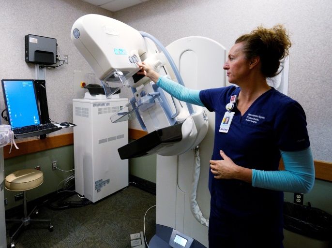 Karen Liley, lead in the mammography unit, demonstrates a GE 3D mammography machine at Littleton Adventist Hospital, part of Centura Health in Littleton, Colorado, U.S. May 3, 2016. REUTERS/Rick Wilking