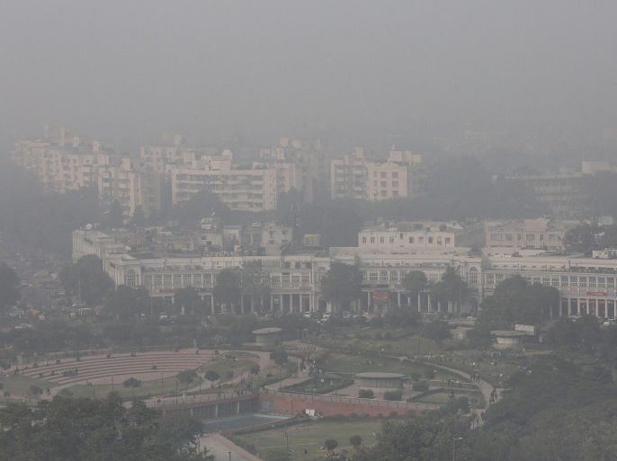 An aerial view of the Connaught Place area of New Delhi, India, as it is surrounded by smog on 08 December 2015. According to the World Health Organization (WHO), Delhi is one of the most polluted cities in the world. Pollution levels for fine particulate matter or PM2.5 at the Anand Vihar monitoring station in New Delhi was 448 micrograms last week while WHO recommends that people are not exposed to PM2.5 levels over 10 micrograms averaged over a year, or 25 microgams over any 24-hour period, as small particles can get deep into the lungs and even enter the bloodstream. To curb the pollution in the city, the Delhi government has proposed that private vehicles with odd or even registration number would be allowed to run on alternate days.