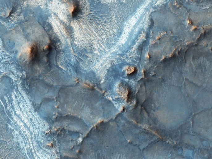 The Nili Fossae region, one of the most colorful regions of the planet Mars located on the northwest rim of Isidis impact basin, is shown in this photo taken February. 5, 2016, by the High Resolution Imaging Science Experiment (HiRISE) camera on NASA's Mars Reconnaissance Orbiter. NASA/JPL-Caltech/University of Arizona/Handout via Reuters ATTENTION EDITORS - THIS IMAGE WAS PROVIDED BY A THIRD PARTY. EDITORIAL USE ONLY