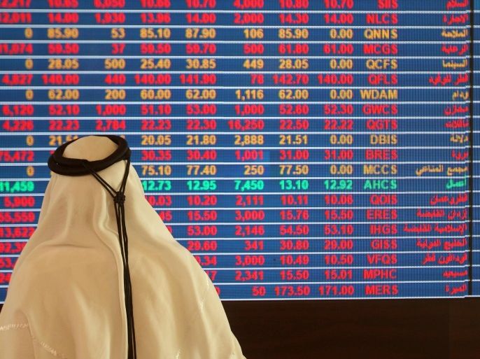 A trader monitors a screen displaying stock information at Qatar Stock Exchange in Doha, Qatar November 9, 2016. REUTERS/Naseem Zeitoon