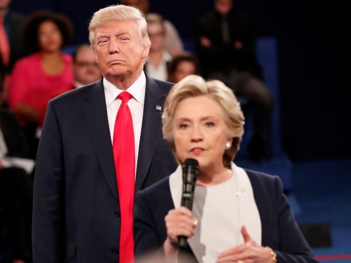 Republican U.S. presidential nominee Donald Trump listens as Democratic nominee Hillary Clinton answers a question from the audience during their presidential town hall debate at Washington University in St. Louis, Missouri, U.S., October 9, 2016. REUTERS/Rick Wilking /File Photo FROM THE FILES PACKAGE "THE CANDIDATES" - SEARCH CANDIDATES FILES FOR ALL 90 IMAGES