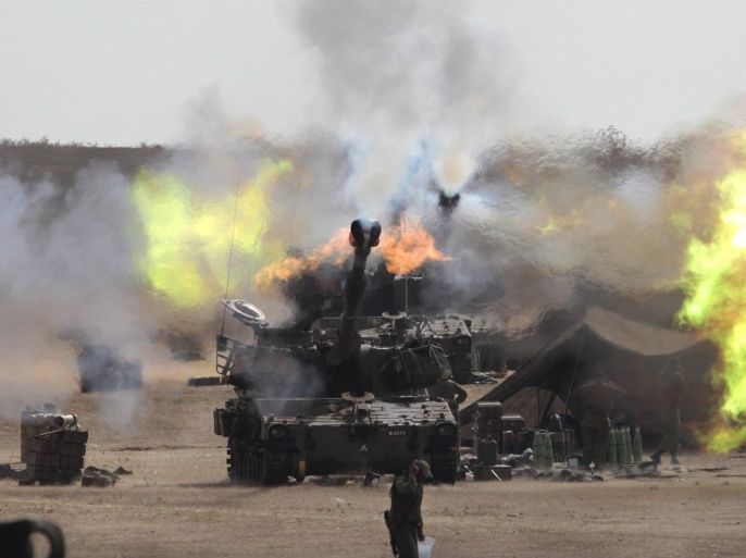 A picture rmade available on 15 August 2014 shows Israeli 155mm artillery guns firing from a base area in southern Israel into the Gaza Strip on 31 July 2014 during Operation Protective Edge. Israeli media reports on August 15 that Israel fired at least 32,000 artillery shells into the Gaza strip and that such massive shelling may have caused a large number of Palestinian civilian deaths.