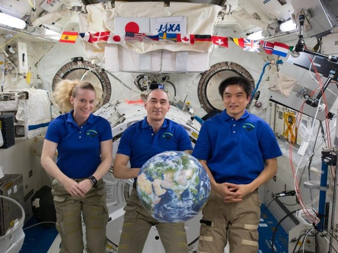 A handout picture made available on 30 October 2016 by National Aeronautics and Space Administration (NASA) shows Expedition 49 crew members Kate Rubins (L) of NASA, Anatoly Ivanishin (C) of the Russian space agency Roscosmos and Takuya Onishi (R) of the Japan Aerospace Exploration Agency concluding a 115-day mission of science and research and prepare to return to Earth aboard the International Space Station, 29 October 2016. Rubins, Ivanishin, and Onishi returned to Earth, on 30 October 2016, after 115 days in space where they served as members of the Expedition 48 and 49 crews onboard the International Space Station. EPA/NASA /HANDOUT