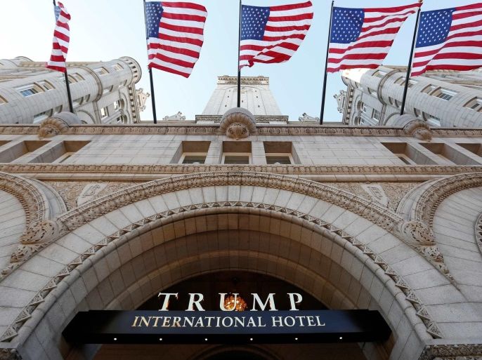 Flags fly above the entrance to the new Trump International Hotel on its opening day in Washington, DC, U.S. September 12, 2016. REUTERS/Kevin Lamarque/File Photo