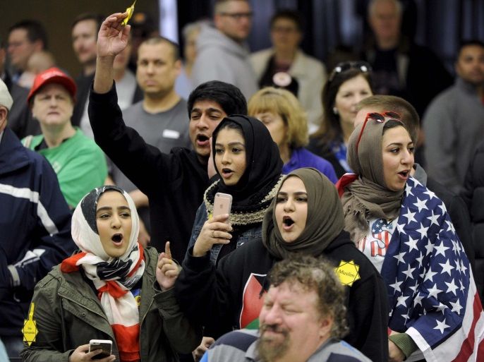 FILE PHOTO - Young Muslims protest against U.S. Republican presidential candidate Donald Trump before being escorted out during a campaign rally in the Kansas Republican Caucus at the Century II Convention and Entertainment Center in Wichita, Kansas March 5, 2016. REUTERS/Dave Kaup/File Photo