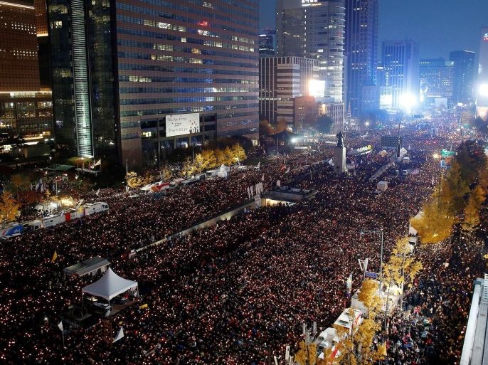 People gather during a protest against South Korean President Park Geun-Hye on a main street in Seoul, South Korea, 12 November 2016. The protesters gathered to demand South Korean President Park's resignation after she had issued a rare public apology on 04 November after acknowledging close ties to Choi Sun-sil, who is in the center of a corruption scandal.