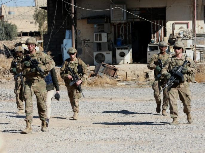 US marine soldiers patrol an area in the formerly IS held town of the Bartila town, some 13 km east of Mosul, Iraq, 23 November 2016. The US-led coalition air strikes destroyed the fourth bridge over the Tigris river in central Mosul to stop Islamic state militants from supporting their forces in the left side of Mosul city, Lt. Gen. Abdul-Wahab al-Saadi, the deputy commander of the counterterrorism forces said. At least 67 thousands people were forced to flee from Mosu