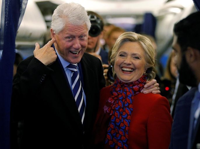 U.S. Democratic presidential nominee Hillary Clinton and her husband, former U.S. President Bill Clinton, talk to reporters on her campaign plane in Philadelphia, Pennsylvania, U.S. November 7, 2016, the final day of campaigning before the election. REUTERS/Brian Snyder