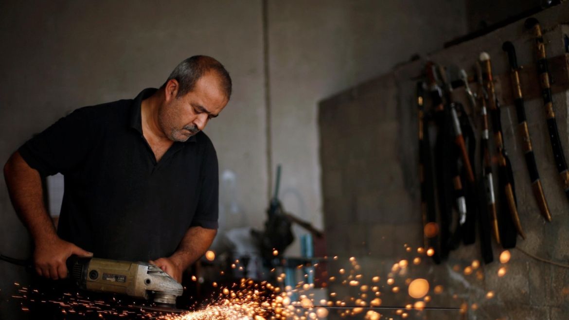Palestinian blacksmith Mueen Abu Wadi, 45, makes swords at his workshop in Gaza City, as part of a job he inherited from his father and grandfather, November 14, 2016. REUTERS/Suhaib Salem