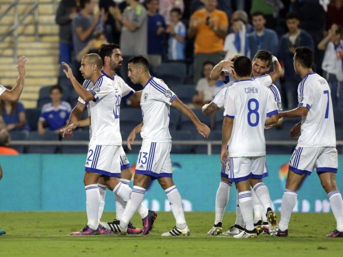Players of Israel celebrate after scoring a goal during the FIFA World Cup 2018 qualification match between Israel and Liechtenstein at the Teddy stadium, Jerusalem, Israel, 09 October 2016.