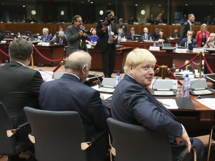 British Foreign Secretary Boris Johnson (R) at the start of European foreign affairs council in Brussels, Belgium, 14 November 2016.