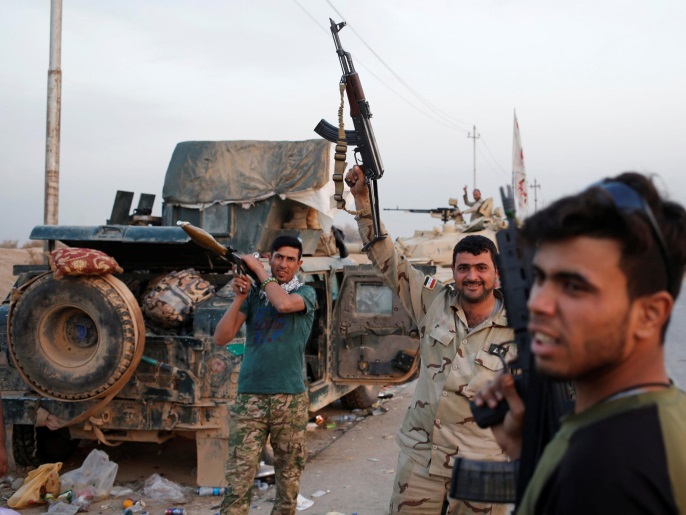 أفراد من القوات الخاصة بحي الكرامة جنوبي الموصل (رويترز)