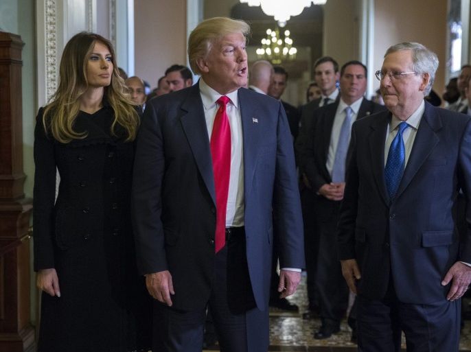 US President elect Donald Trump (C), with his wife Melania Trump (L), and Senate Majority Leader Mitch McConnell (R), responds to a question from the news media after a meeting in the Majority Leaders office in the US Capitol in Washington, DC, USA, 10 November 2016. Earlier in the day President elect Trump met with US President Barack Obama and Speaker of the House Paul Ryan.
