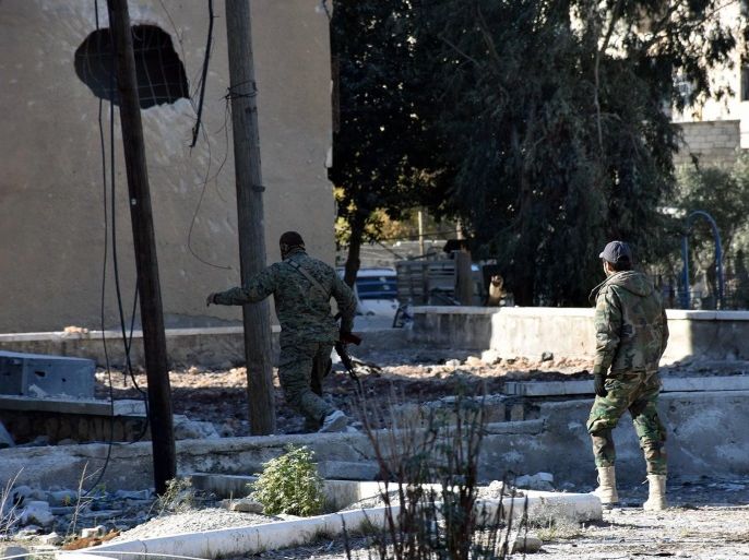 A handout picture made available by the official Syrian Arab News Agency (SANA) shows Syrian soldiers in Aleppo's eastern Masaken Hanano area in Aleppo province, Syria, 27 November 2016. According to SANA a military source announced on 27 November 2016 that the army units in cooperation with the supporting forces established full control over Jabal Badro neighborhood and Masaken Hanano area in Aleppo . EPA/SANA HANDOUT