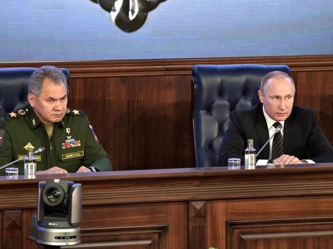 Russian President Vladimir Putin and Defence Minister Sergei Shoigu attend a Defense Ministry board meeting in Moscow, Russia December 22, 2016. Sputnik/Kremlin/Alexei Nikolskyi via REUTERS ATTENTION EDITORS - THIS IMAGE WAS PROVIDED BY A THIRD PARTY. EDITORIAL USE ONLY.