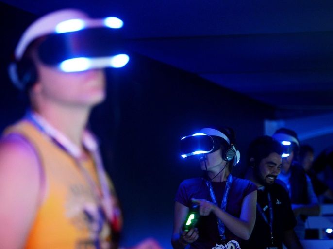 Attendees try out Sony's Project Morpheus virtual reality headset at the 2014 Electronic Entertainment Expo, known as E3, in Los Angeles, California June 11, 2014. REUTERS/Kevork Djansezian/File Photo GLOBAL BUSINESS WEEK AHEAD PACKAGE SEARCH BUSINESS WEEK AHEAD JUNE 27 FOR ALL IMAGES