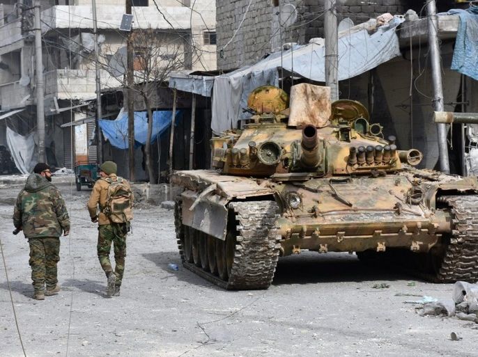 A handout photograph released by the official Syrian Arab News Agency (SANA) on 13 December 2016 showing Syrian soldiers walking next to a tank after government forces took control over the neighborhood in Aleppo, Syria, 12 December 2016. Media reports state the Syrian army on 12 December claimed it had recaptured 98 percent of former rebel territory in eastern Aleppo. The huge regime gains come as part of the military offensive launched by forces loyal to President Bashar Assad on 15 November. Since then, over 1,000 people have been killed in the northern Syrian city. EPA/SANA HANDOUT